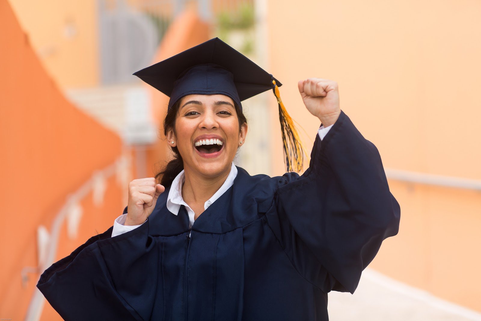 bigstock-Young-Hispanic-Female-Graduate-343959088