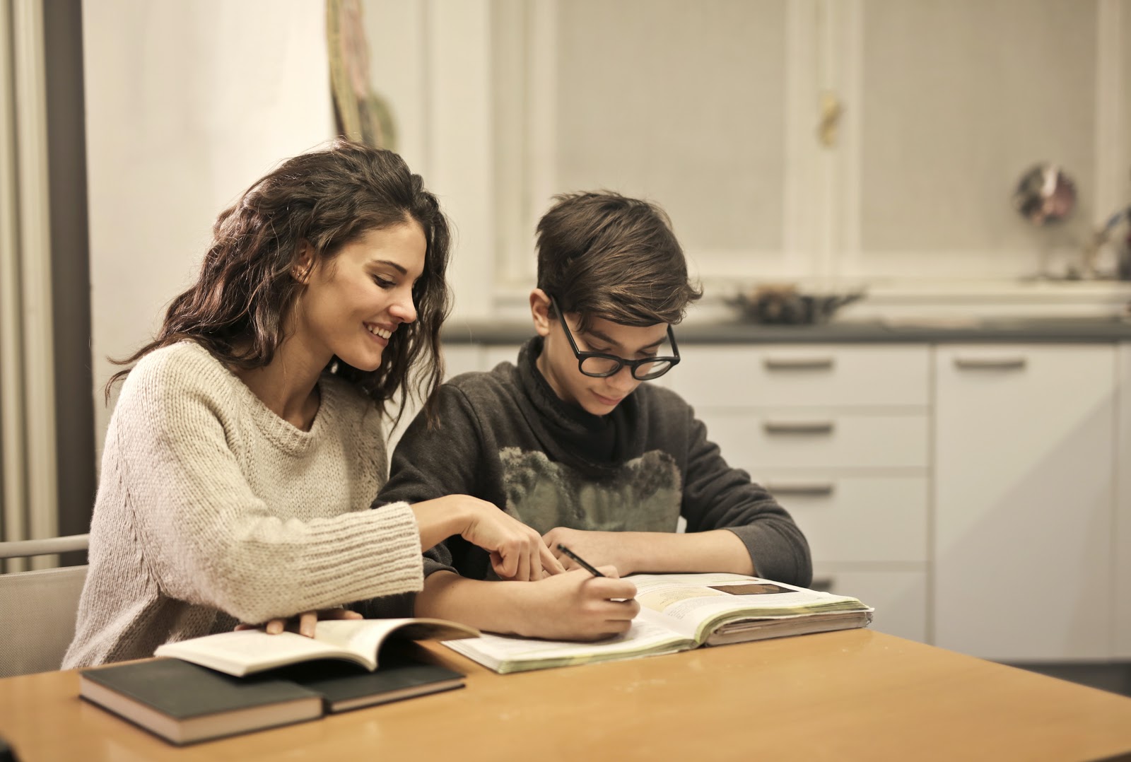 elder-sister-and-brother-studying-at-home-3769981-1